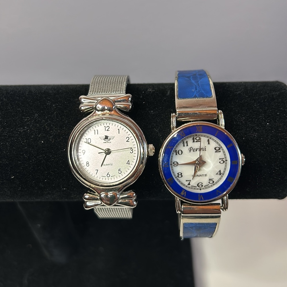 Two vintage quartz watches one stainless steel with hearts one with blue trim